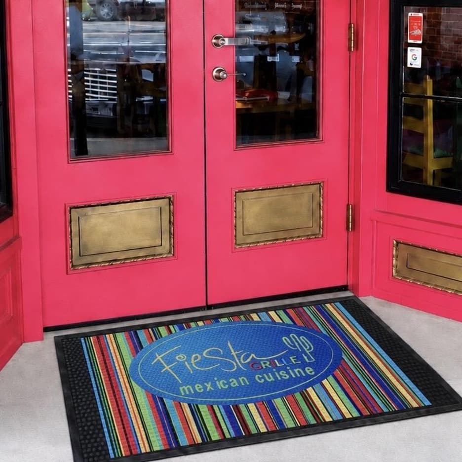 Outdoor Scraper Logo Mat installed outside a restaurant entrance