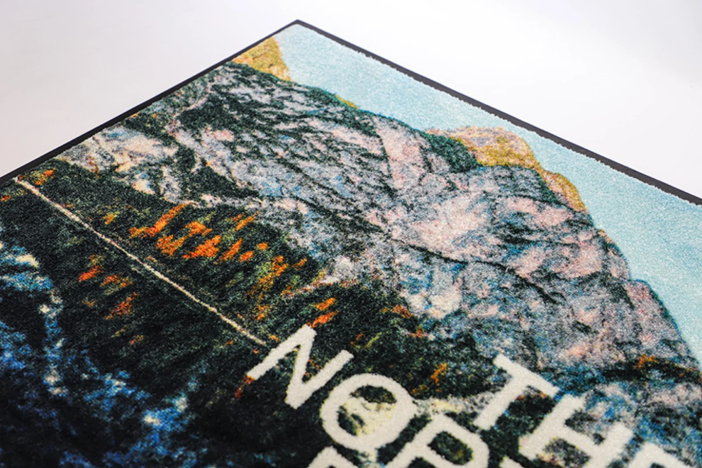 Close-up of Signature HD Logo Mat printed detail