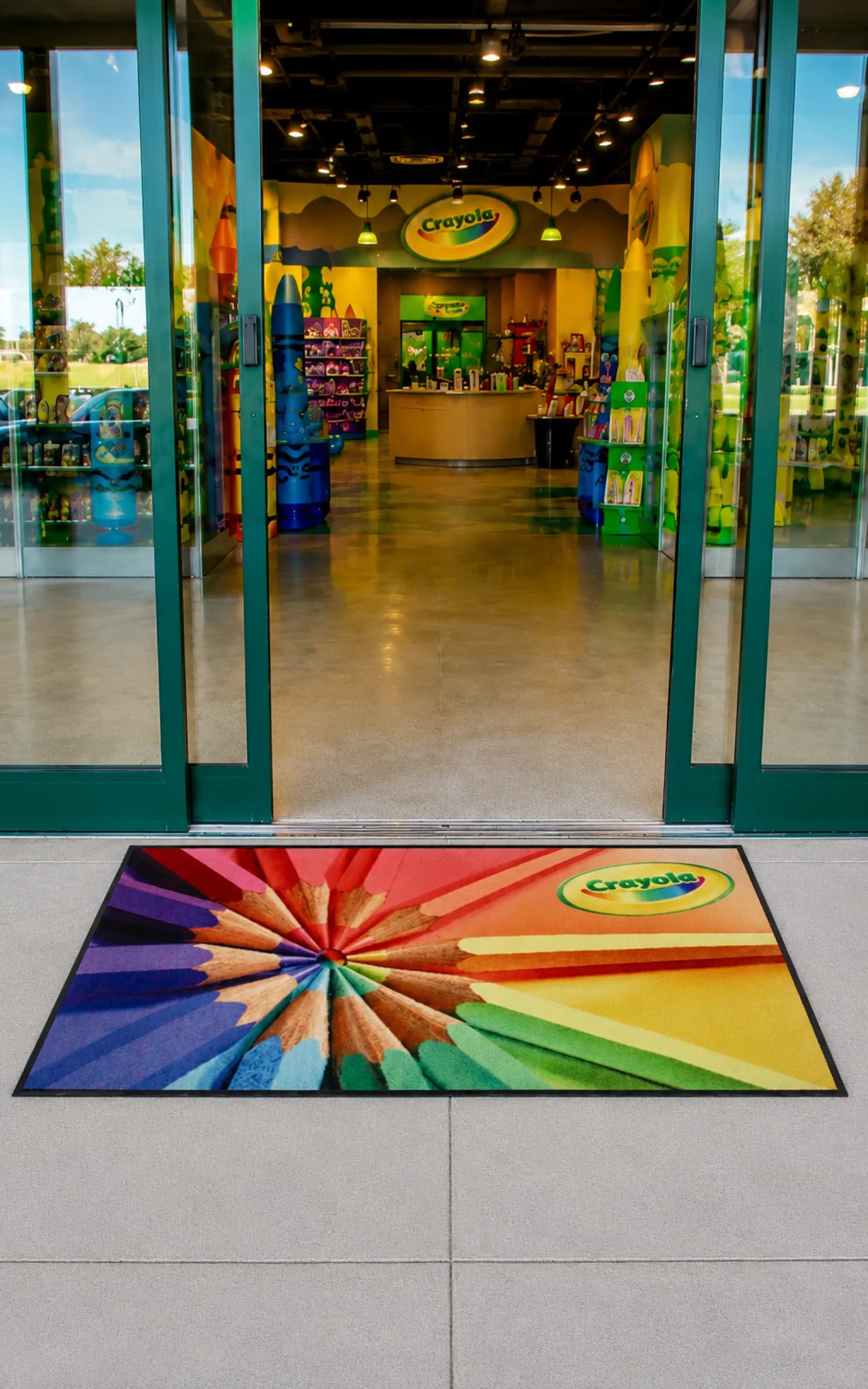 Custom logo mat installed at a commercial entrance for a bulk order