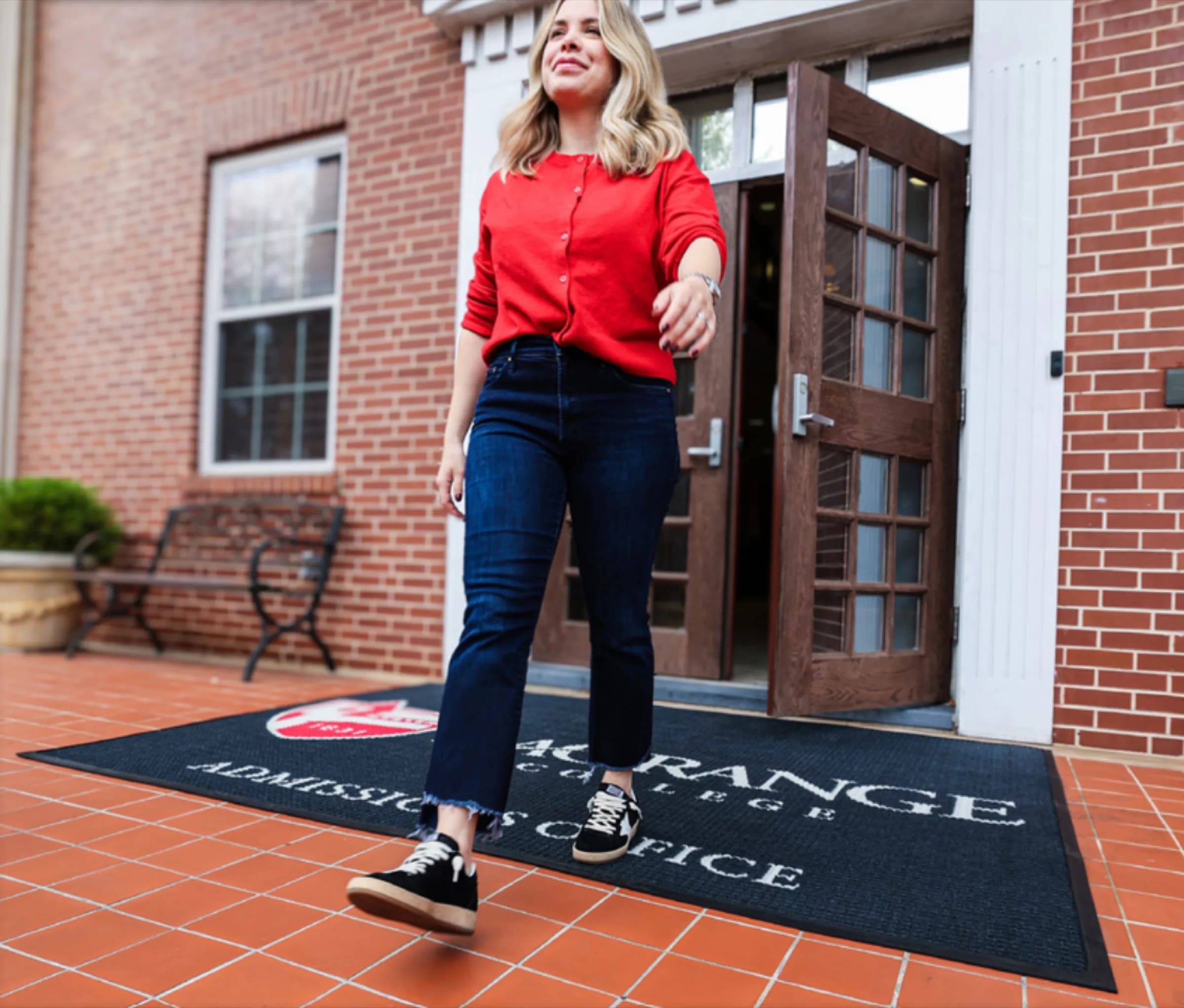 Custom logo mat at a front entrance