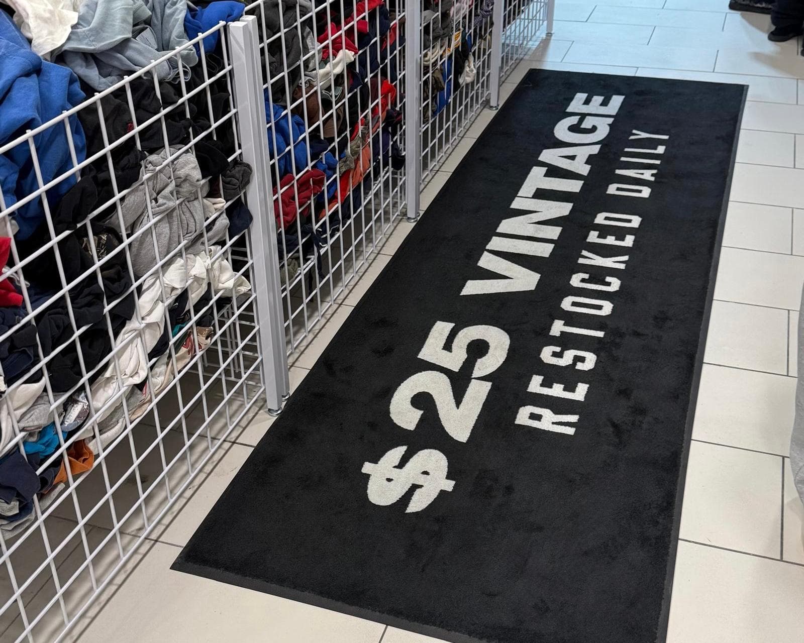 Vintage 25 custom logo runner installed in a retail store