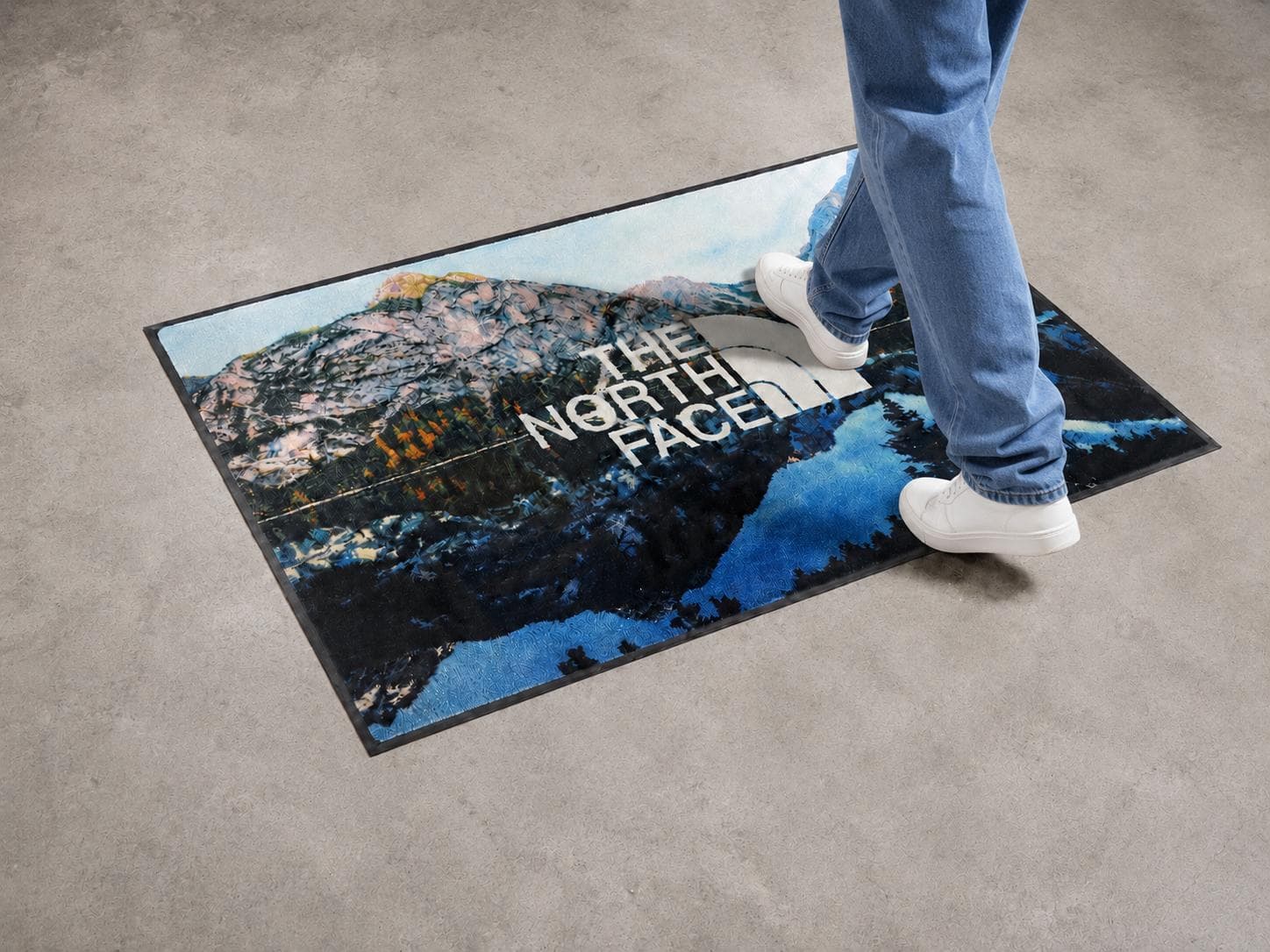The North Face custom logo mat in a commercial space